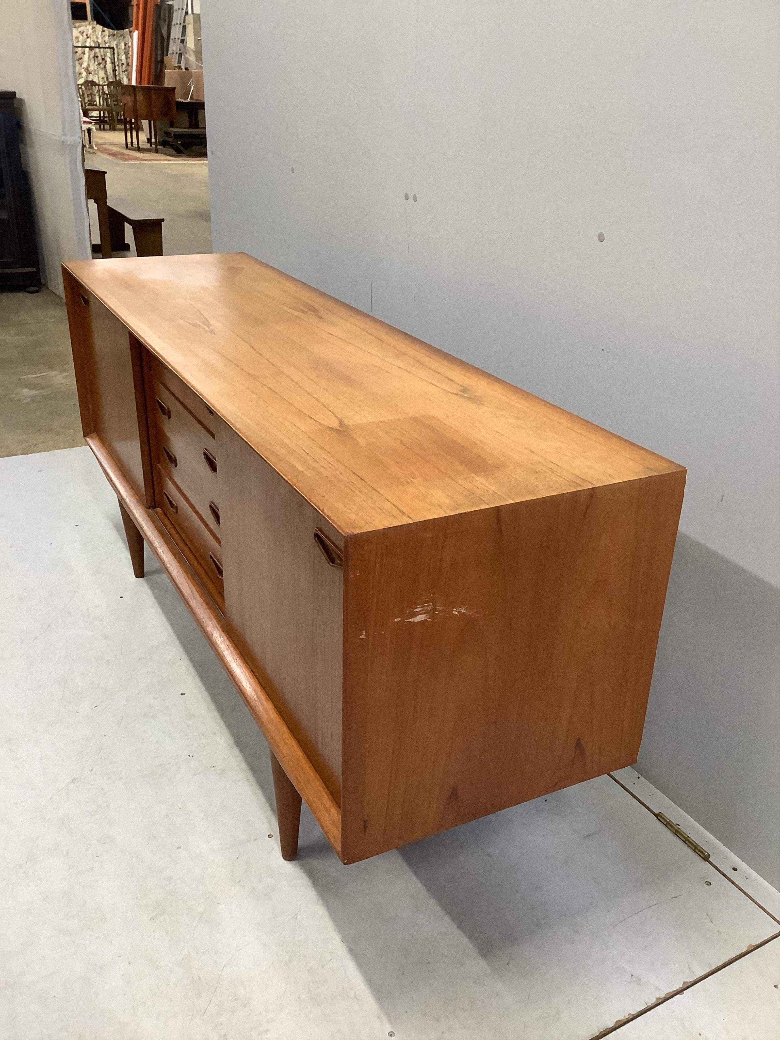 Clausen & Son, a mid century Danish teak sideboard, width 160cm, depth 45cm, height 70cm. Condition - fair